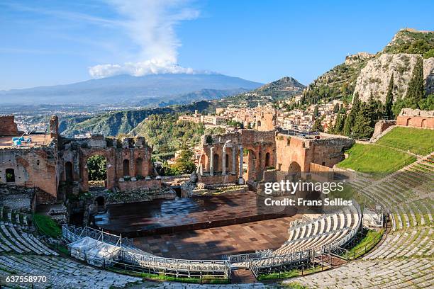 the greek theatre (teatro greco) and mount etna, taormina, sicily - teatro greco taormina bildbanksfoton och bilder