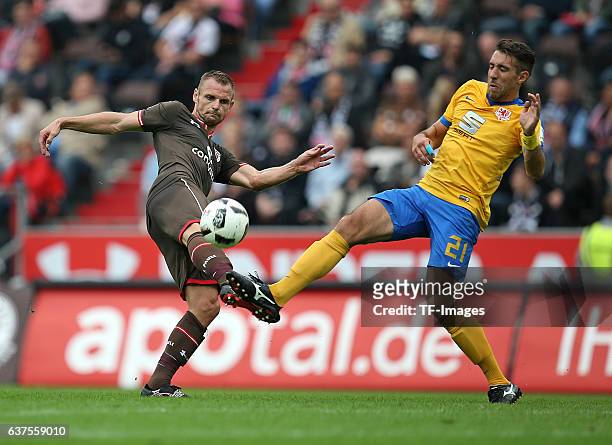 Bernd Nehrig of Pauli and Patrick Schoenfeld of Braunschweig battle for the ball during the Second Bandesliga match between FC St. Pauli and...