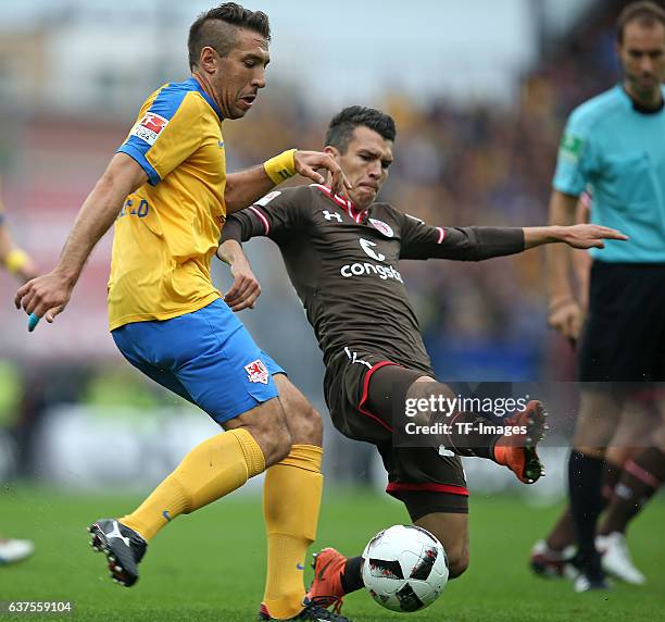 Patrick Schoenfeld of Braunschweig and Waldemar Sobota of Pauli battle for the ball during the Second Bandesliga match between FC St. Pauli and...