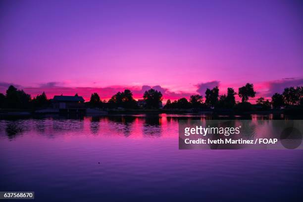 scenic view of river at sunset - thornton stock pictures, royalty-free photos & images