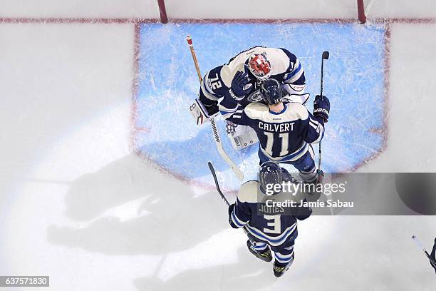 Goaltender Sergei Bobrovsky of the Columbus Blue Jackets celebrates a 3-1over the Edmonton Oilers with Matt Calvert of the Columbus Blue Jackets and...