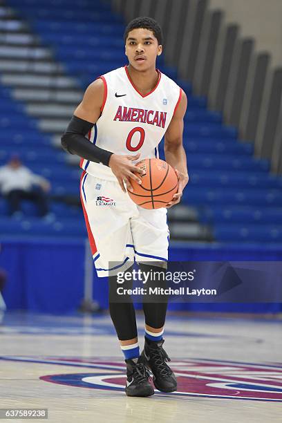 Sa'eed Nelson of the American University Eagles looks to pass the ball during a college basketball game against the American University Eagles at...