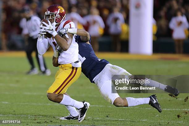 Wide receiver Darreus Rogers of the USC Trojans catches the ball against Christian Campbell of the Penn State Nittney Lions in the 2017 Rose Bowl...