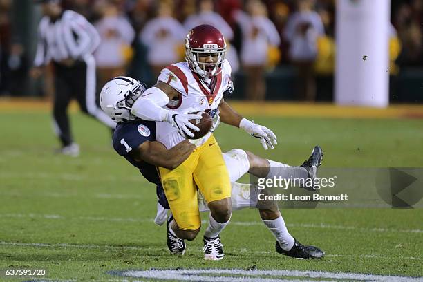 Wide receiver Darreus Rogers of the USC Trojans catches the ball against Christian Campbell of the Penn State Nittney Lions in the 2017 Rose Bowl...