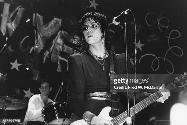 American Rock musician Joan Jett plays guitar as she performs with her band, the Blackhearts, onstage at the Ritz, New York, New York, December 31,...