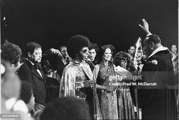 American Rock and Soul musician Sly Stone and model Kathy Silva are married onstage at Madison Square Garden by Bishop BR Stewart , New York, New...