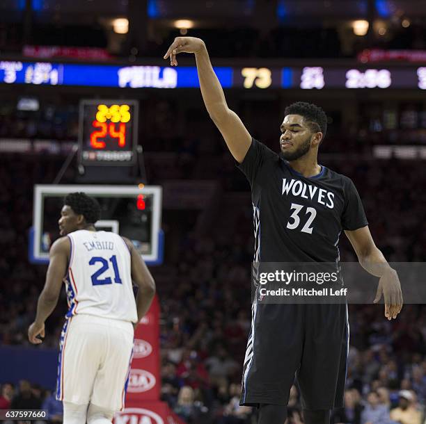 Karl-Anthony Towns of the Minnesota Timberwolves reacts after missing a shot against Joel Embiid of the Philadelphia 76ers in the third quarter at...