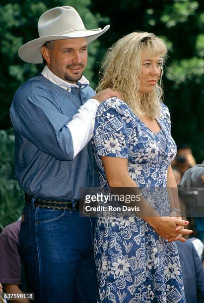 Country singer Garth Brooks and his wife Sandy Mahl pose for a portrait while getting a star on the Hollywood Walk of Fame on June 30, 1995 in...