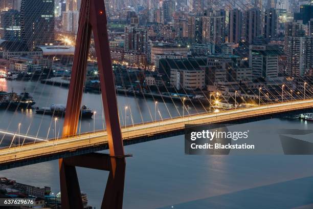 the yangpu bridge - city night stock illustrations