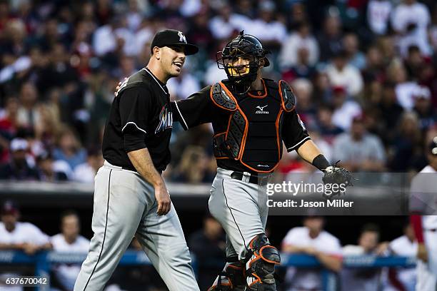 Starting pitcher Jose Fernandez of the Miami Marlins and catcher Jeff Mathis talk between plays during the second inning against the Cleveland...