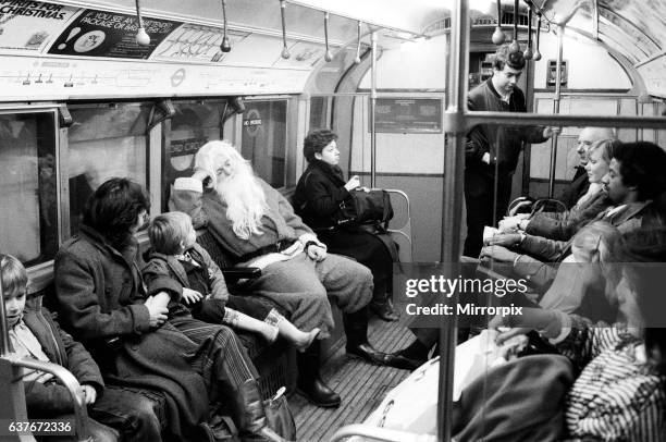 Father Christmas, of Bentall's Store, Ealing, takes the tube to pick up his sleigh. He seems to get no reaction from the commuters. 20th December...