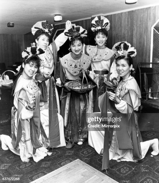 Chinese girls perform the Fairy's Flower Dance at the New Year Celebrations held at the Mayfair Ballroom, to celebrate the oncoming Year of the...