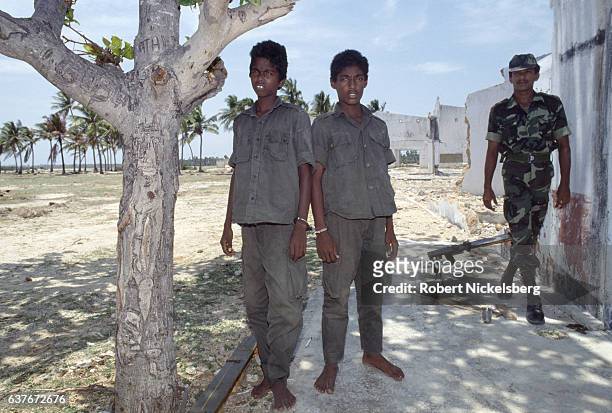 Two handcuffed Tamil soldiers from the Liberation Tigers of Tamil Eelam, or LTTE, are shown in custody September 14, 1990 as Sri Lankan Army soldiers...