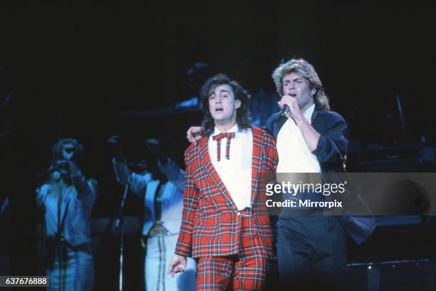 British pop group Wham pictured on their 10-day visit to China, April 1985. George Michael and Andrew Ridgeley, on stage during the band's concert at...