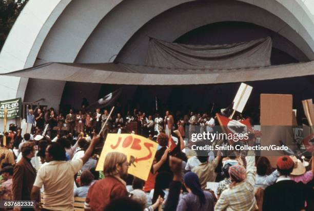 Crowd of senior citizens stopped to hear speeches at a rally to protest inflation, unemployment, and high taxes, Lake Shore Drive, Chicago, Illinois,...