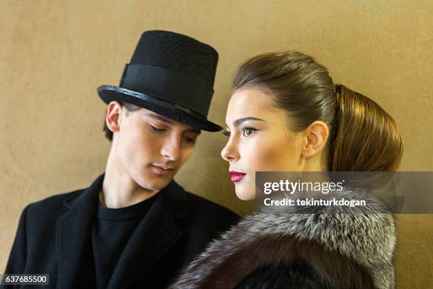 young ukranian models posing with costume at lviv ukraine - man fedora room stock pictures, royalty-free photos & images