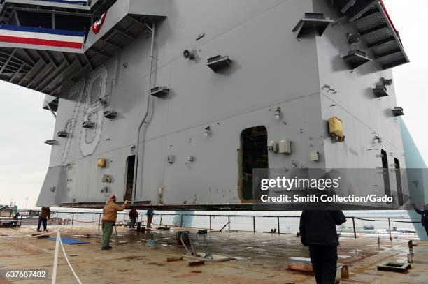 An island for the nuclear powered aircraft carrier USS Gerald R Ford put on deck during an island landing ceremony at Huntington Ingalls...