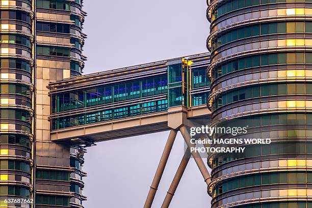 petronas twin towers skybridge - petronas towers stock pictures, royalty-free photos & images