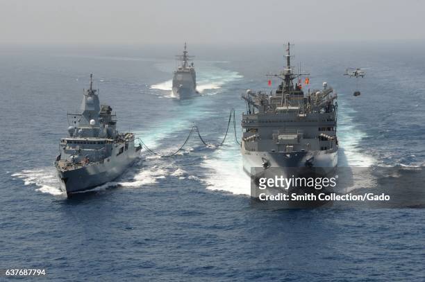 Guided-missile cruiser USS Hue City , the German navy frigate FGS Hamburd , the aircraft carrier USS Dwight D. Eisenhower , and the Military Sealift...