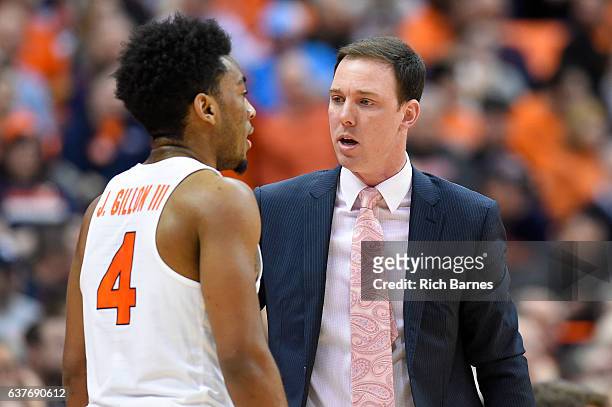 Assistant coach Gerry McNamara of the Syracuse Orange talks with John Gillon against the Miami Hurricanes during the first half at the Carrier Dome...