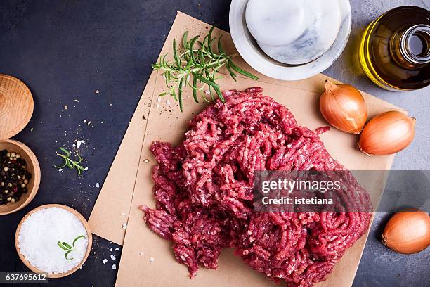 organic homemade minced meat on craft paper - ground beef stock pictures, royalty-free photos & images