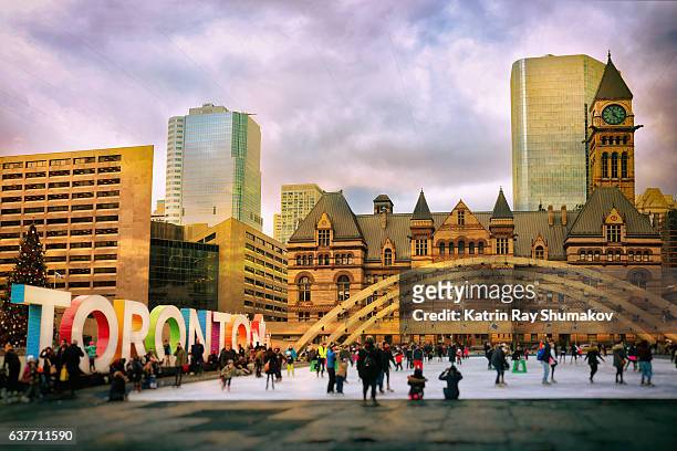 toronto winter fun on nathan phillips square - toronto stock pictures, royalty-free photos & images