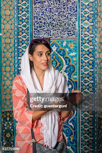 Female iranian tourguide wearing a headscarf, Yazd, Iran Female iranian tourguide wearing a headscarf, Yazd, Iran