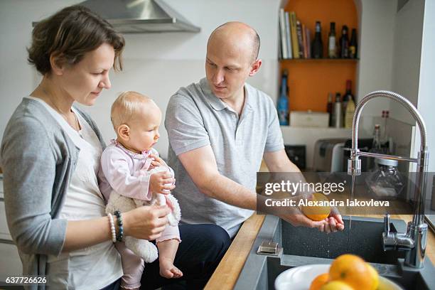 family cooking breakfast together - iakovleva stock pictures, royalty-free photos & images