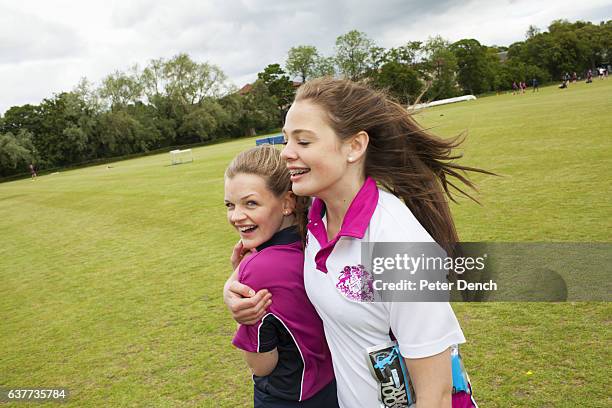 Girls during a physical education lesson on the playing fields at Fettes College. Fettes College is a private coeducational independent boarding and...