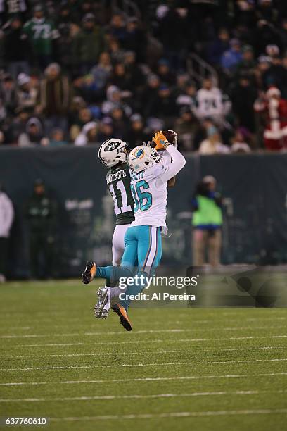 Cornerback Tony Lippett of the Miami Dolphins has an Interception against the New York Jets at MetLife Stadium on December 17, 2016 in East...