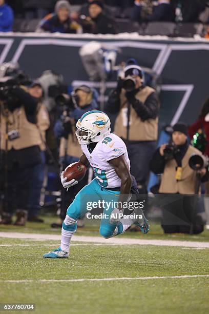 Wide Receiver Jakeem Grant of the Miami Dolphins has a long gain against the New York Jets at MetLife Stadium on December 17, 2016 in East...