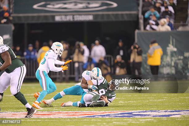 Linebacker Neville Hewitt of the Miami Dolphins has a sack against the New York Jets at MetLife Stadium on December 17, 2016 in East Rutherford, New...