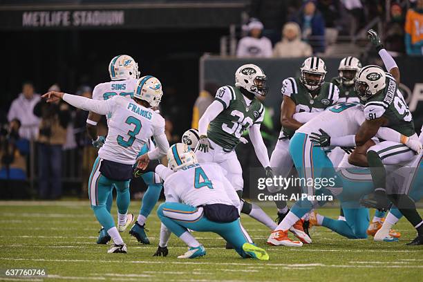 Kicker Andrew Franks of the Miami Dolphins kicks an extra point against the New York Jets at MetLife Stadium on December 17, 2016 in East Rutherford,...