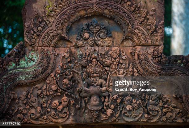 the details of tympanum in ban teay srei temple the beautiful pink sandstone in siem reap, cambodia. - khmer stock pictures, royalty-free photos & images