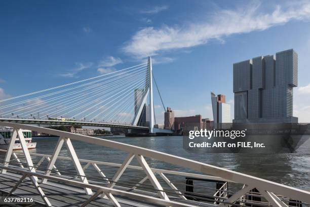 rotterdam skyline. erasamus bridge and the de rotterdam was designed by rem koolhas in 1998 and completed in 2013. - nieuwe maas river stock pictures, royalty-free photos & images