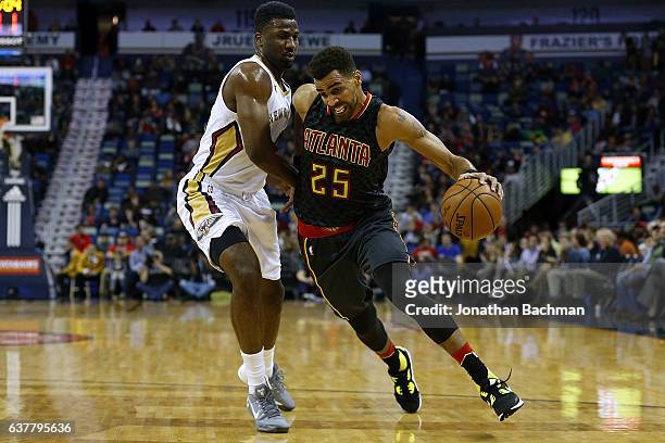 Thabo Sefolosha of the Atlanta Hawks drives against Terrence Jones of the New Orleans Pelicans during the first half of a game at the Smoothie King...