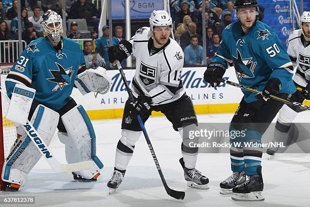 Kyle Clifford of the Los Angeles Kings skates against Martin Jones and Chris Tierney of the San Jose Sharks at SAP Center on January 3, 2017 in San...