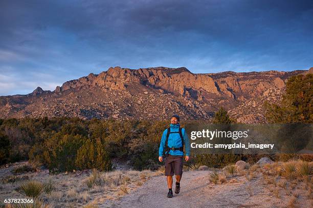 explore new mexico nature man hiking - sandia mountains stock pictures, royalty-free photos & images