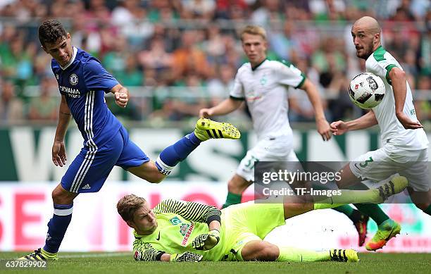 Oscar of Chelsea and Goalkeeper Felix Wiedwald of Bremen , Papy Djilobodji of Chelsea battle for the ball during the pre-season friendly match...