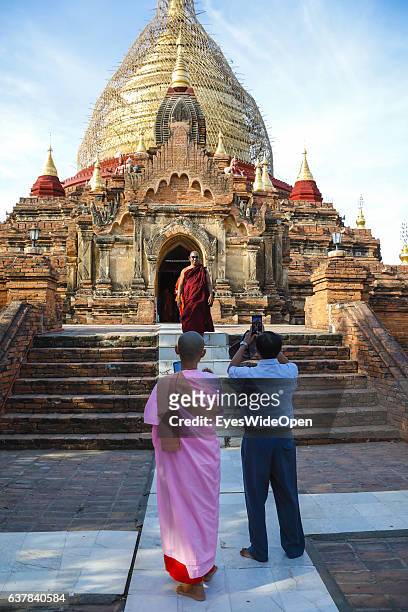 Tourist and local people visit the Dhammayazika Pagoda in the historical zone Bagan with thousands of pagodas and temples on December 10, 2016 in...
