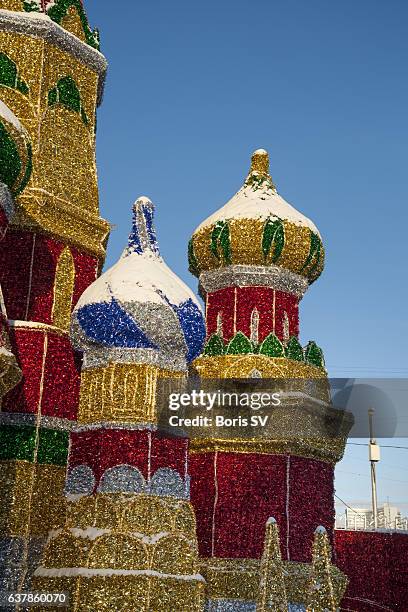 illuminated replica of st. basils cathedral in moscow - orthodox christians celebrate christmas in moscow stock pictures, royalty-free photos & images