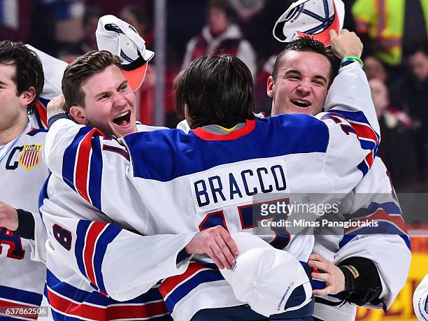 Adam Fox , Jeremy Bracco and Tyler Parsons of Team United States celebrate as they win the gold medal round against Team Canada during the 2017 IIHF...