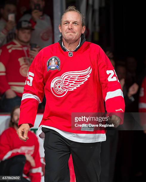 Former forward Darren McCarty of the Detroit Red Wings 1997 Stanley Cup Team walks out for the Twenty Year Anniversary celebration night, pre-game...