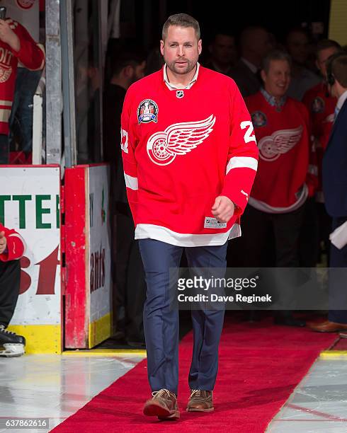 Former defenseman Aaron Ward of the Detroit Red Wings 1997 Stanley Cup Team walks out for the Twenty Year Anniversary celebration night, pre-game...