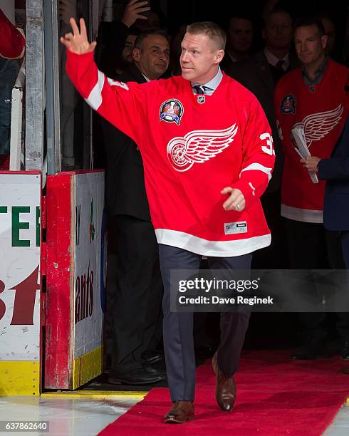 Former forward Kris Draper of the Detroit Red Wings 1997 Stanley Cup Team walks out for the Twenty Year Anniversary celebration night, pre-game...