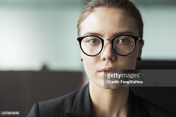 young woman portrait in business office - trumpet bildbanksfoton och bilder