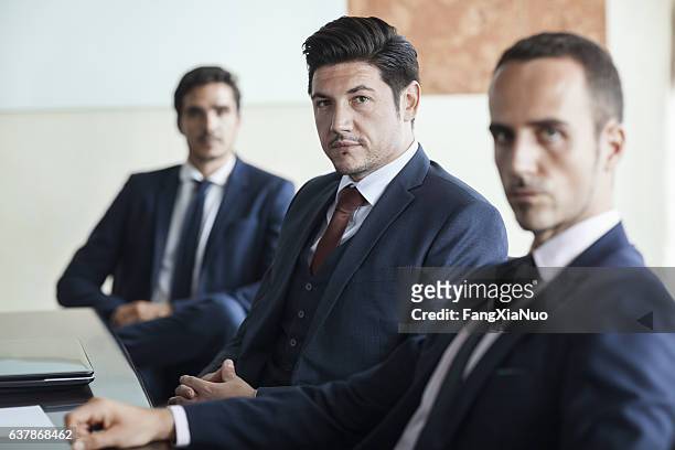 portrait of businessmen in office conference room - smug 個照片及圖片檔