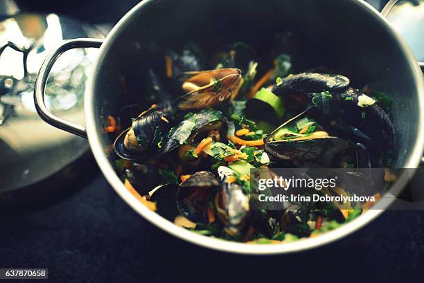 cooking mussels with vegetables - traditionally belgian stock pictures, royalty-free photos & images