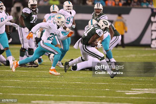 Wide Receiver Quincy Enunwa of the New York Jets has a long gain against the Miami Dolphins at MetLife Stadium on December 17, 2016 in East...