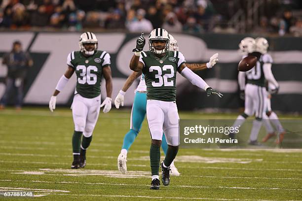 Cornerback Juston Burris of the New York Jets has his first career Interception against the Miami Dolphins at MetLife Stadium on December 17, 2016 in...